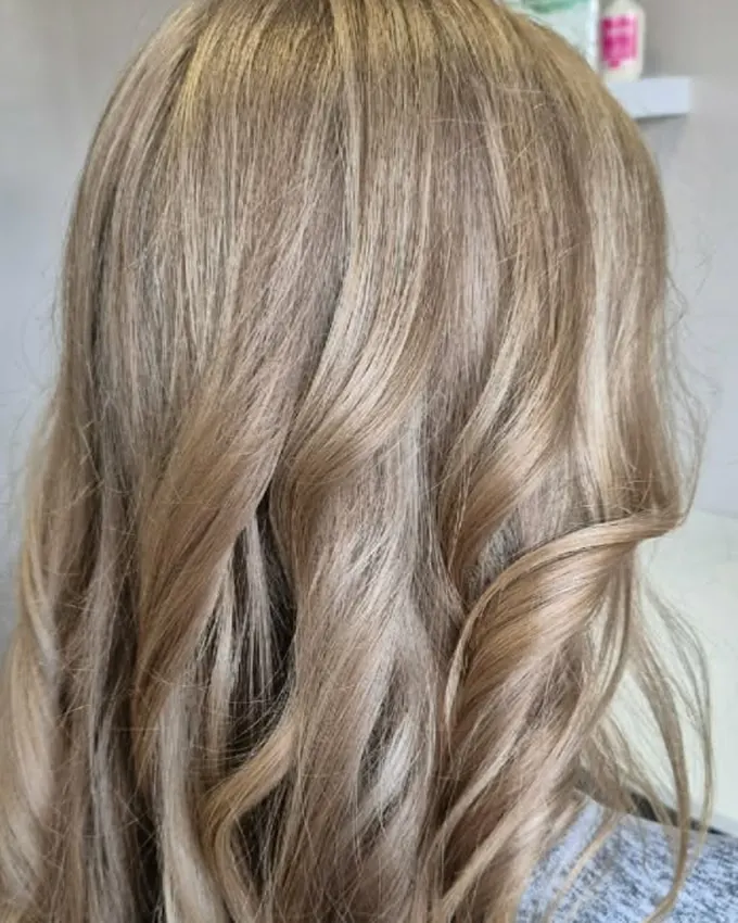 The same hair in defined, glossy waves
