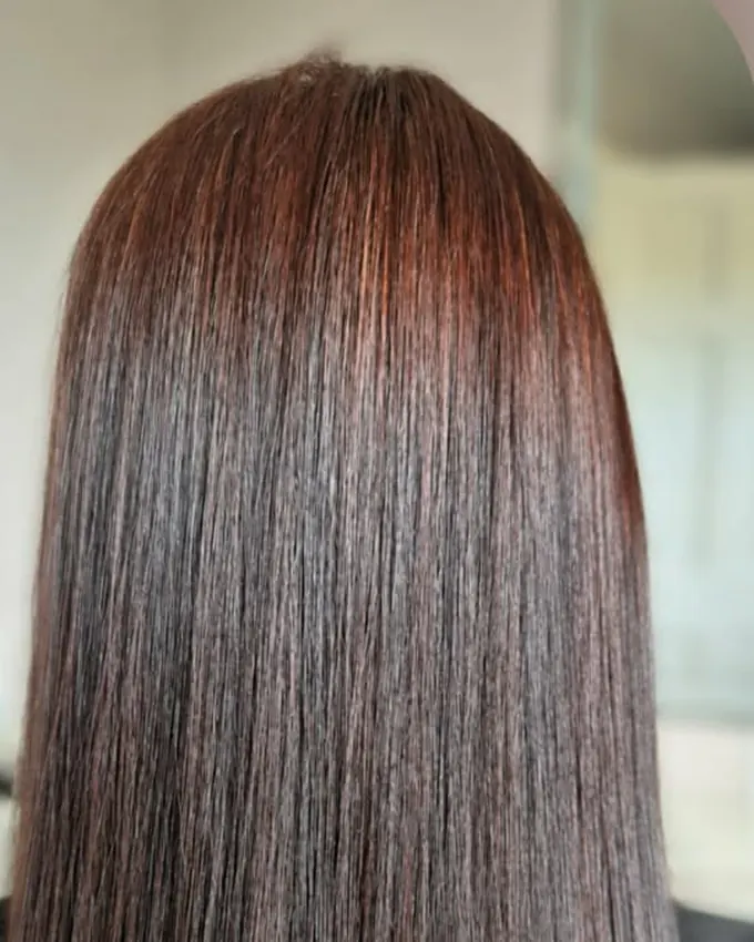 The same hair smooth, with warm copper reflections